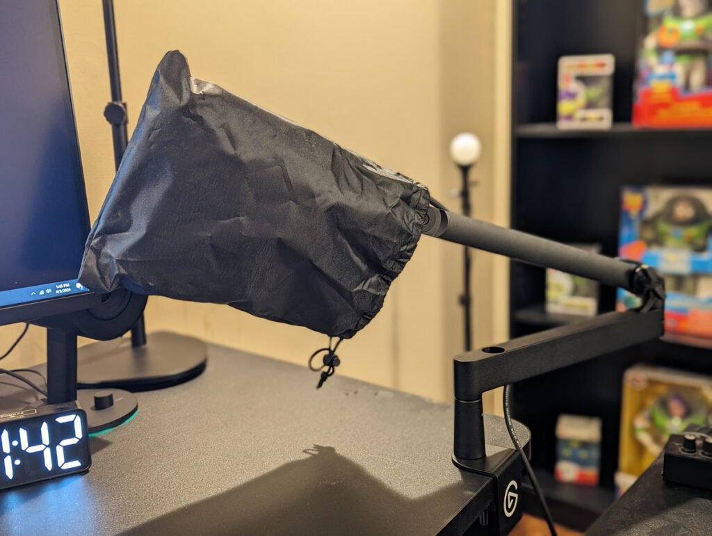 Shure SM7B covered by a small nylon synch bag